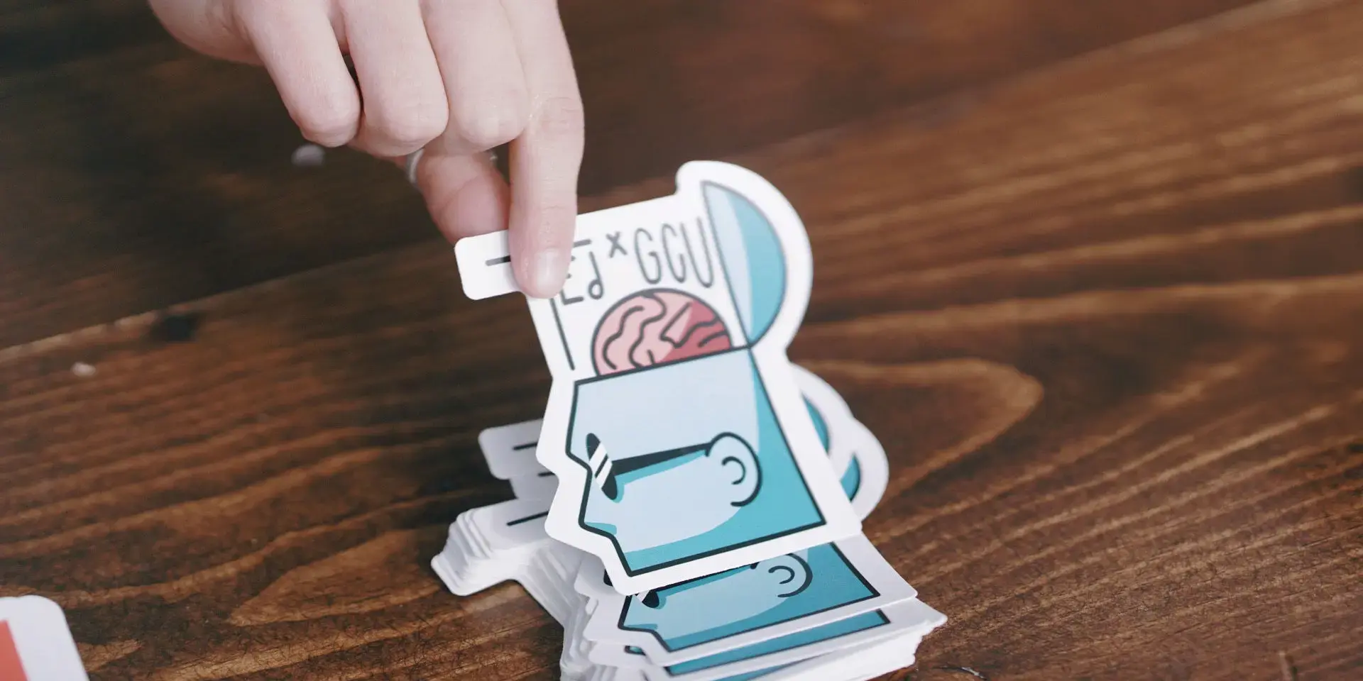 Close-up of a custom die-cut sticker printed by Artisan Colour, showcasing vivid artwork and specialty label printing.